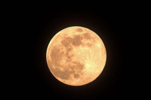 The supermoon looks bright just after sunset on April 7.