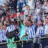 LONDON, ENGLAND - MAY 29: Liam Palmer and Barry Bannan of Sheffield Wednesday celebrate while holding the trophy alongside their teammates after the team's victory and promotion to the Sky Bet Championship in the Sky Bet League One Play-Off Final between Barnsley and Sheffield Wednesday at Wembley Stadium on May 29, 2023 in London, England. (Photo by Catherine Ivill/Getty Images)