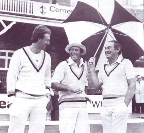 Geoff Boycott shares a joke with Arnie Sidebottom and Ray Illingworth in front of the Pavilion at North Marine Road during Yorkshire's County Championship match against Sussex in 1982.