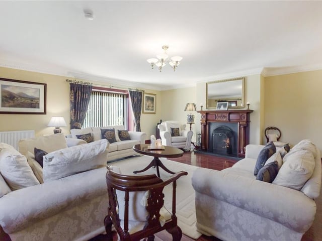 Formal lounge with solid fuel fireplace.