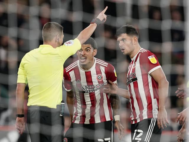 Sheffield, England, 19th October 2021. Morgan Gibbs-White of Sheffield Utd (C) reacts after being sent off during the Sky Bet Championship match at Bramall Lane, Sheffield. Picture credit should read: Andrew Yates / Sportimage