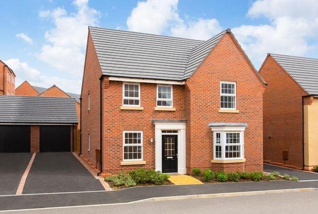 This four bedroom house has an open-plan dining kitchen with family area and 'glazed pod' with French doors to garden. Marketed by David Wilson Homes, 01623 355820.