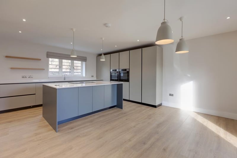 A superb dining kitchen with a contemporary Karl Benz kitchen with fabulously appointed integrated appliances.