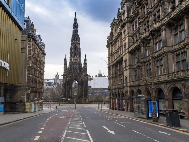 Eerie streets in March as lockdown was just announced- such as this one in Edinburgh around the Scott Monument at the east end of Princes Street- filled us with a shocking sense of isolation.