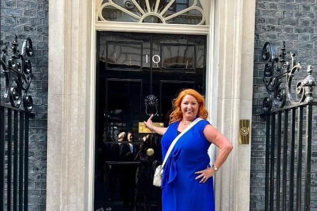 Julia Hall, from Dinnington's Julz Boutique, outside 10 Downing Street, the home of the Prime Minister.