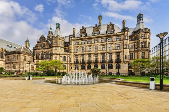 Sheffield Town Hall with multi jet fountain and the Peace Gardens, South Yorkshire, England.