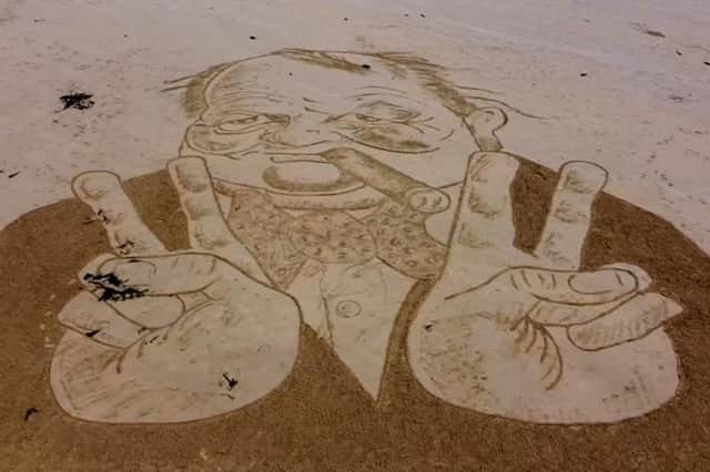 Rhis stunning picture of Churchill was created in the sans at Whitburn beach by Jax Higginson.