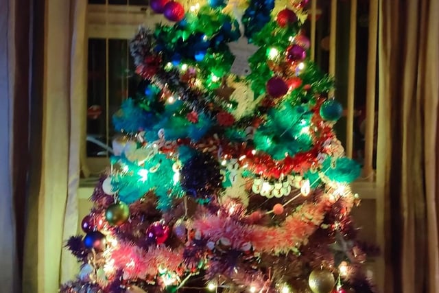 Michila Marie Rose's tree is laden with decorations.