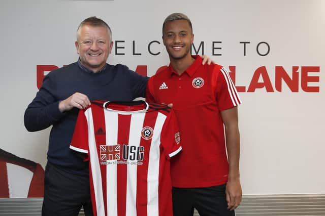 Chris Wilder, the manager of Sheffield United, with new signing Richairo Zivkovic: Simon Bellis/Sportimage