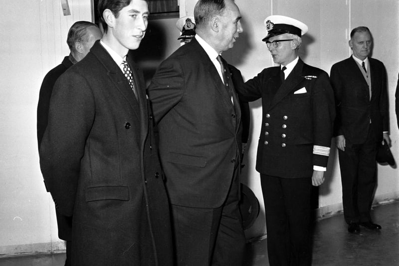 A young Prince Charles is shown around the Queen Elizabeth II liner en route to John Brown's shipyard on the Clyde in November 1968. With the Prince is Sir Basil Smallpiece and Captain Bill Warwick.