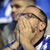 A dejected Sheffield Wednesday fan looks on at Hillsborough after play-off defeat to Sunderland.