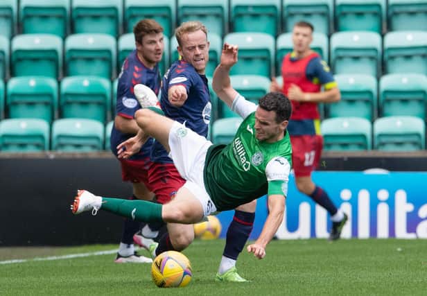 Paul McGinn and Kilmarnock's Rory McKenzie battle for the ball at Easter Road