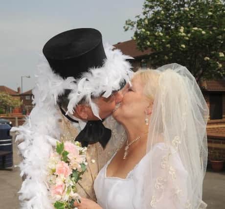 Bob Hope and Denise Head kiss to celebrate their wedding in 2011.