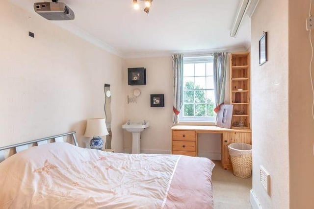 The property boasts a plethora of bedrooms. In the main house, there are six in total, including this one, while the extension includes a further two.