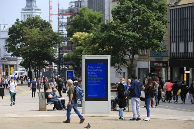Shops in Sheffield City Centre start to reopen on Monday June 15th. Shoppers on Fargate. Picture: Chris Etchells