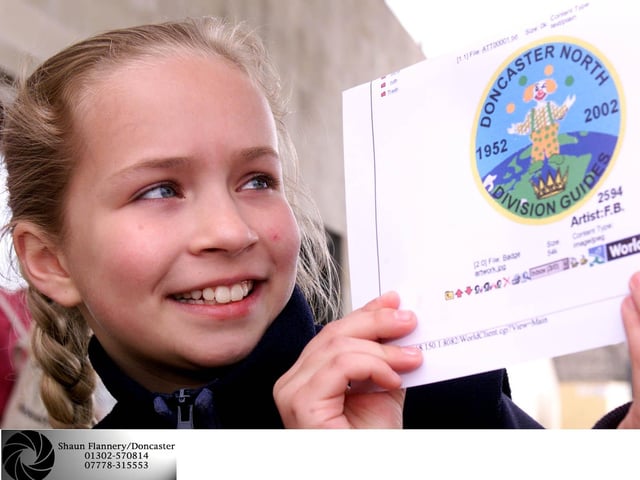 Doncaster North Rainbows, Brownies & Guides celebration of the Queens Golden Jubilee enjoy Circus Skills at Denaby's Earth Centre. Jessica Barrowman (11) of the 14th Doncaster Guides pictured with her winning badge design to mark the Queen's Golden Jubilee in 2002