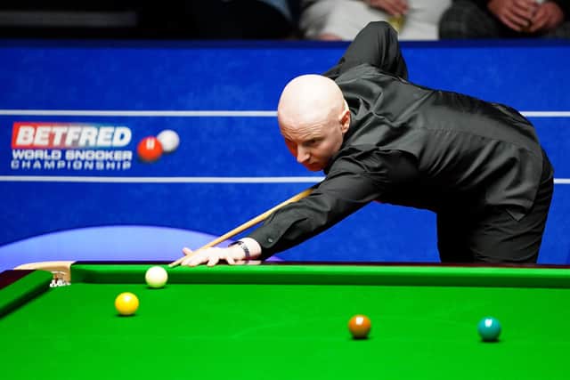 Scotland's Anthony McGill in action against England's Liam Highfield during day two of the Betfred World Snooker Championships at The Crucible.