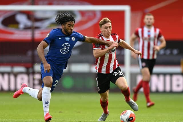 Ben Osborn of Sheffield United and Reece James of Chelsea challenge for the ball during the home side's 3-0 win at Bramall Lane: Shaun Botterill/Getty Images