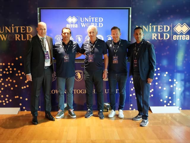 Representatives from Errea and United World, including Sheffield United chief executive Steve Bettis (second right) gather at the company's HQ near Parma