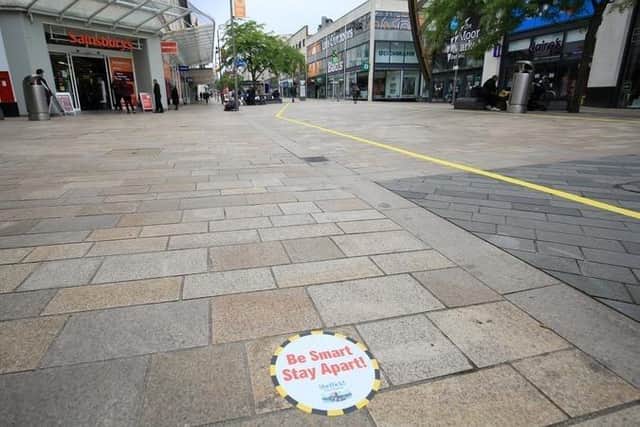 Stickers reminding customers to keep a safe distance while shopping have also appeared on The Moor.