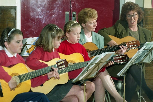Extra curricular music teaching at Havelock Primary was described as outstanding in 1997. Are you one of the pupils pictured with the teachers?