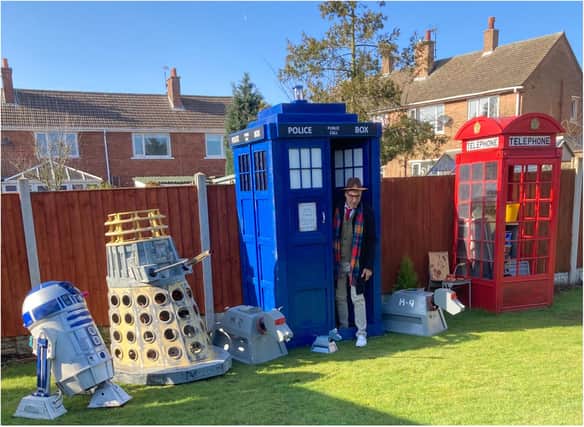 Ricky Butler with his TARDIS and collection of sci-fi replica models.