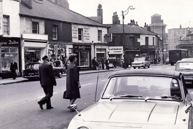 The junction of West Street and Glossop Road in October, 1968, showing hairdresser Marjorie Dalton,  grocer J Pollard, Barclays Bank, Ariston Tobacconists and Clarks of Retford.