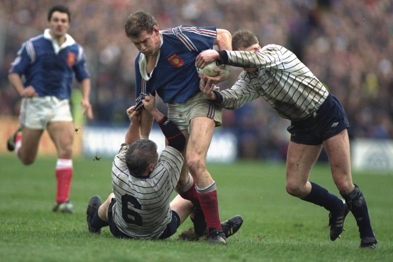 March 7, 1992:  Scotland 10, France 6, Five Nations
Andries van Heerden of France being pulled down by Fife's David McIvor at Murrayfield (Photo: Chris Cole/Allsport/Getty Images)
