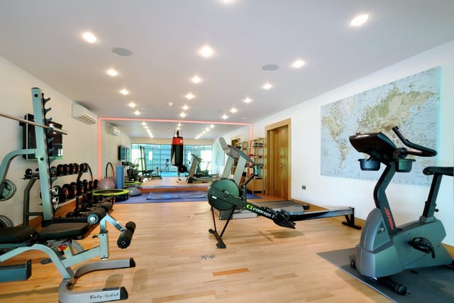 Adjoining the pool is a modern home gym, which is large enough to accommodate several machines and workout equipment.