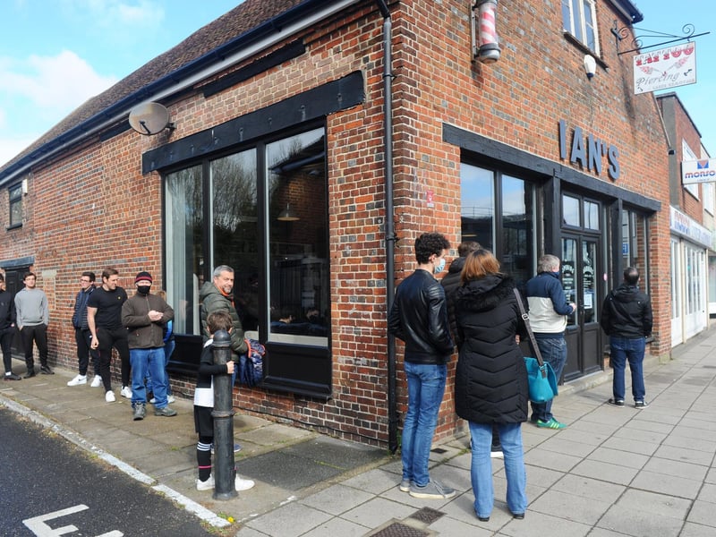 A queue at Ian's Barbers along Park Road, Havant. Picture: Sarah Standing (120421-6454)
