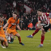Sheffield, England, 15th February 2022. Billy Sharp of Sheffield United has a shot on goal during the Sky Bet Championship match at Bramall Lane, Sheffield. Picture credit should read: Andrew Yates / Sportimage