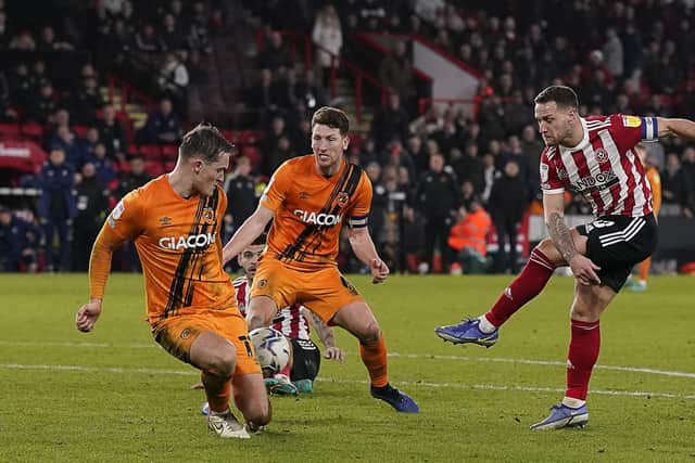 Sheffield, England, 15th February 2022. Billy Sharp of Sheffield United has a shot on goal during the Sky Bet Championship match at Bramall Lane, Sheffield. Picture credit should read: Andrew Yates / Sportimage