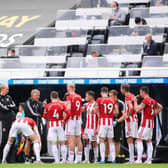 Sheffield United's Chris Wilder (C Left) speaks to his players during a drinks break during the English Premier League football match between Newcastle United and Sheffield United at St James' Park in Newcastle-upon-Tyne, north east England:  LAURENCE GRIFFITHS/POOL/AFP via Getty Images