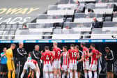Sheffield United's Chris Wilder (C Left) speaks to his players during a drinks break during the English Premier League football match between Newcastle United and Sheffield United at St James' Park in Newcastle-upon-Tyne, north east England:  LAURENCE GRIFFITHS/POOL/AFP via Getty Images