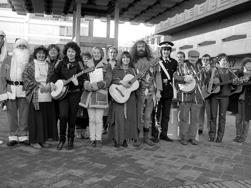 Sutton folk singers singing carols in the Idlewells