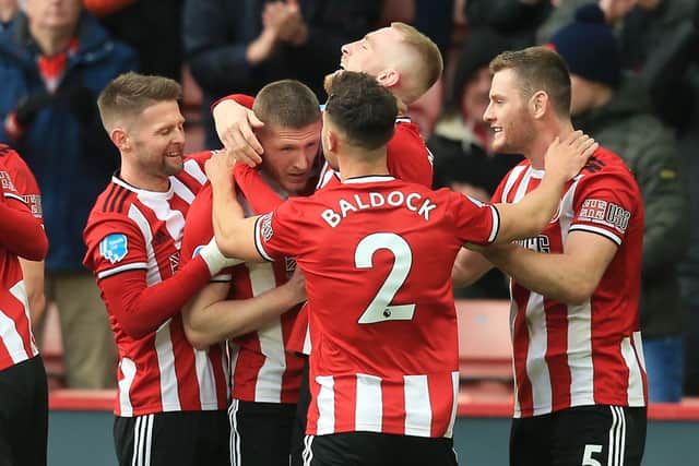 Midfielder John Lundstram (2nd L) celebrates with teammates after scoring their second goal during the English Premier League football match between Sheffield United and Bournemouth at Bramall Lane in Sheffield: LINDSEY PARNABY/AFP via Getty Images