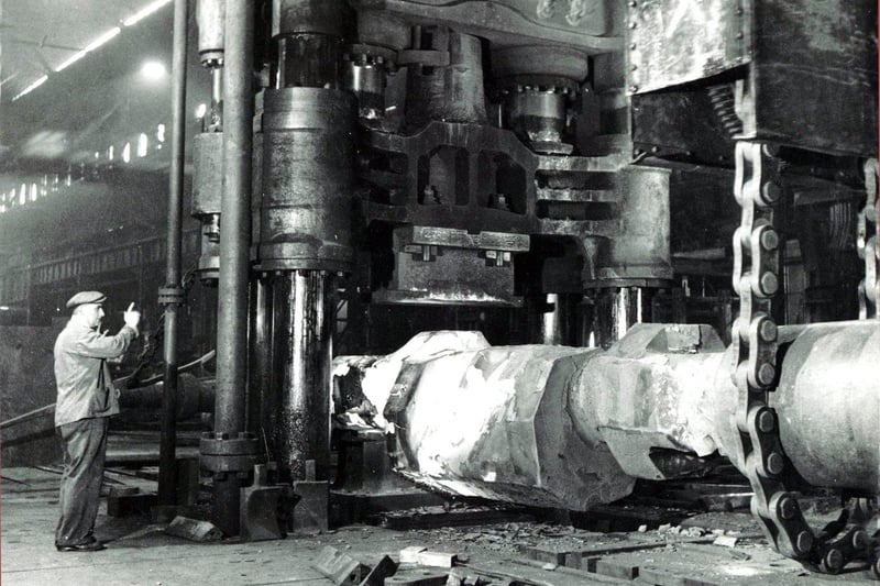 Forging a crankshaft part for a built-up Doxford Diesel Marine Engine, under a 2,300-ton press. The press was commissioned in 1897 and lasted right up to 2007.  It is believed this photo was taken in the early 1950s