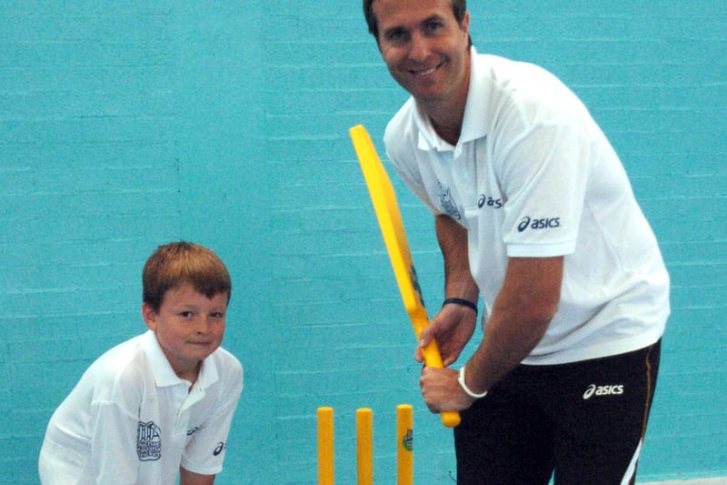 Cricketer Michael Vaughan visited the Goodwin Sports Centre in Sheffield to give some coaching tips to children during the summer holidays. Ten-year-old Charlie Fletcher watches as Michael takes the bat
