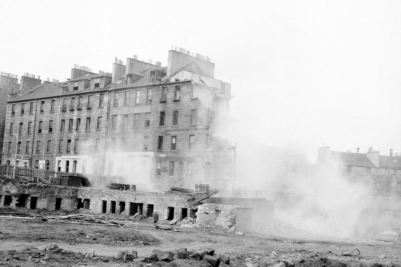 A view showing John Hunter & Sons (Demolition Workers) Ltd. demolishing St James Square, 1960s.