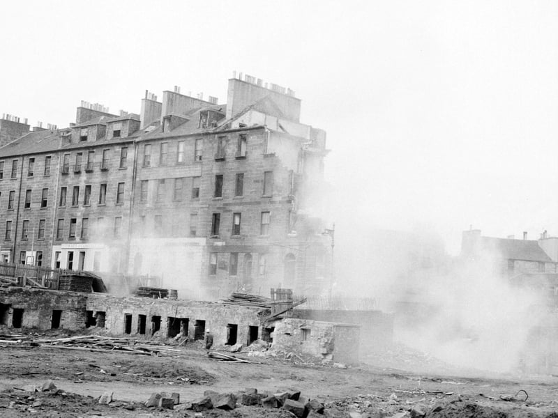 A view showing John Hunter & Sons (Demolition Workers) Ltd. demolishing St James Square, 1960s.