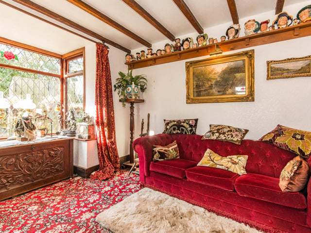 The sitting room has a fireplace and a bay window.
