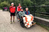 Cycling Without Age riders John and Jill  (holiday makers with Dementia Adventure) on the Monsal Trail with pilots Peter Wozencroft and Clare Rishbeth
