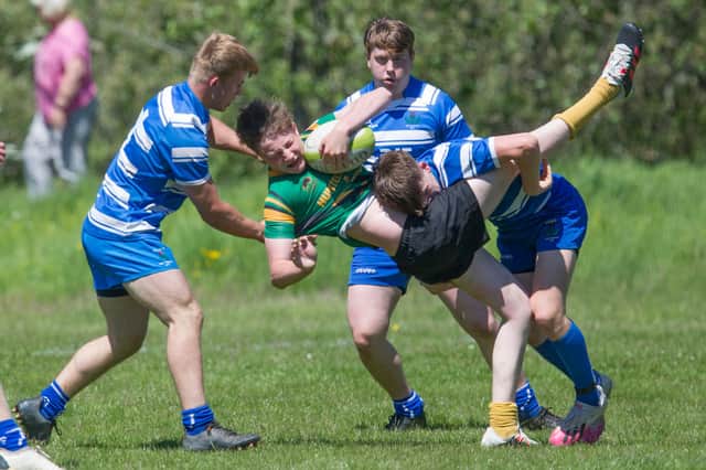 Selkirk player Seb Mackay being put under pressure by Jed Thistle at Melrose on Saturday