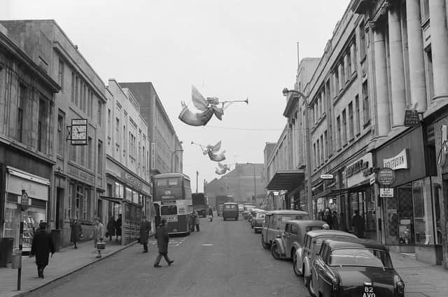 Regent Street in 1963, showcasing the Christmas angels.