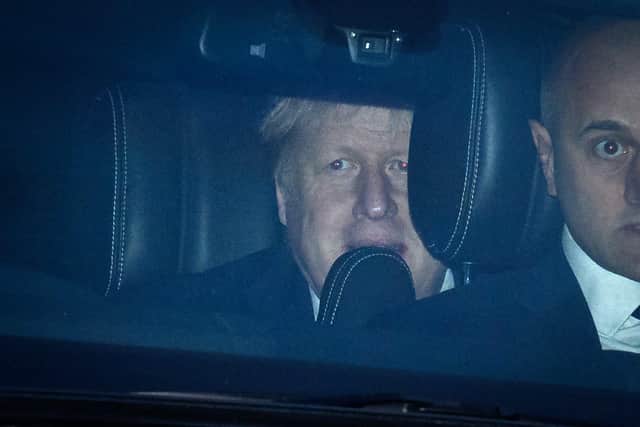Britain's Prime Minister Boris Johnson is driven from Downing Street on January 31, 2022 in London, England.