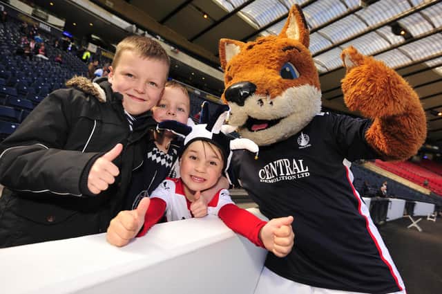 From left to right are Liam Bouch (7), Dylan Macdonald (8) and Ross Duff (5) and Fergus the Fox