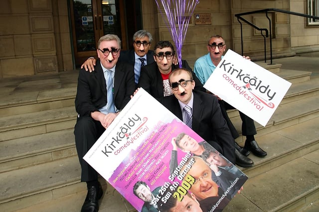 Launching the festival with a photo-shoot complete with comedy glasses - Adam Hills joined by Allan Crow, editor, Fife Free Press, and Sunil Varu and Colin Brown from Kirkcaldy town centre BIDF company
