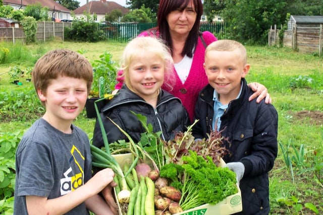 The green fingered youngsters at the Hip Hop gardening group in Hyde Park, Doncaster, with their harvested produce in 2012. From the left Harry Jones, Kacey Titterton, Teresa Froggatt, the growing group co-ordinator, and Mitchell Falstone.
