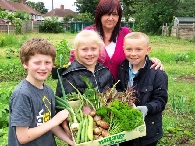 The green fingered youngsters at the Hip Hop gardening group in Hyde Park, Doncaster, with their harvested produce in 2012. From the left Harry Jones, Kacey Titterton, Teresa Froggatt, the growing group co-ordinator, and Mitchell Falstone.