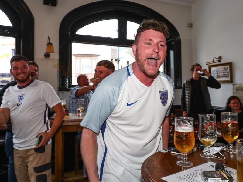 Fans pictured in The Kings pub celebrating on the final whistle. Picture: Stuart Martin (220421-7042)
